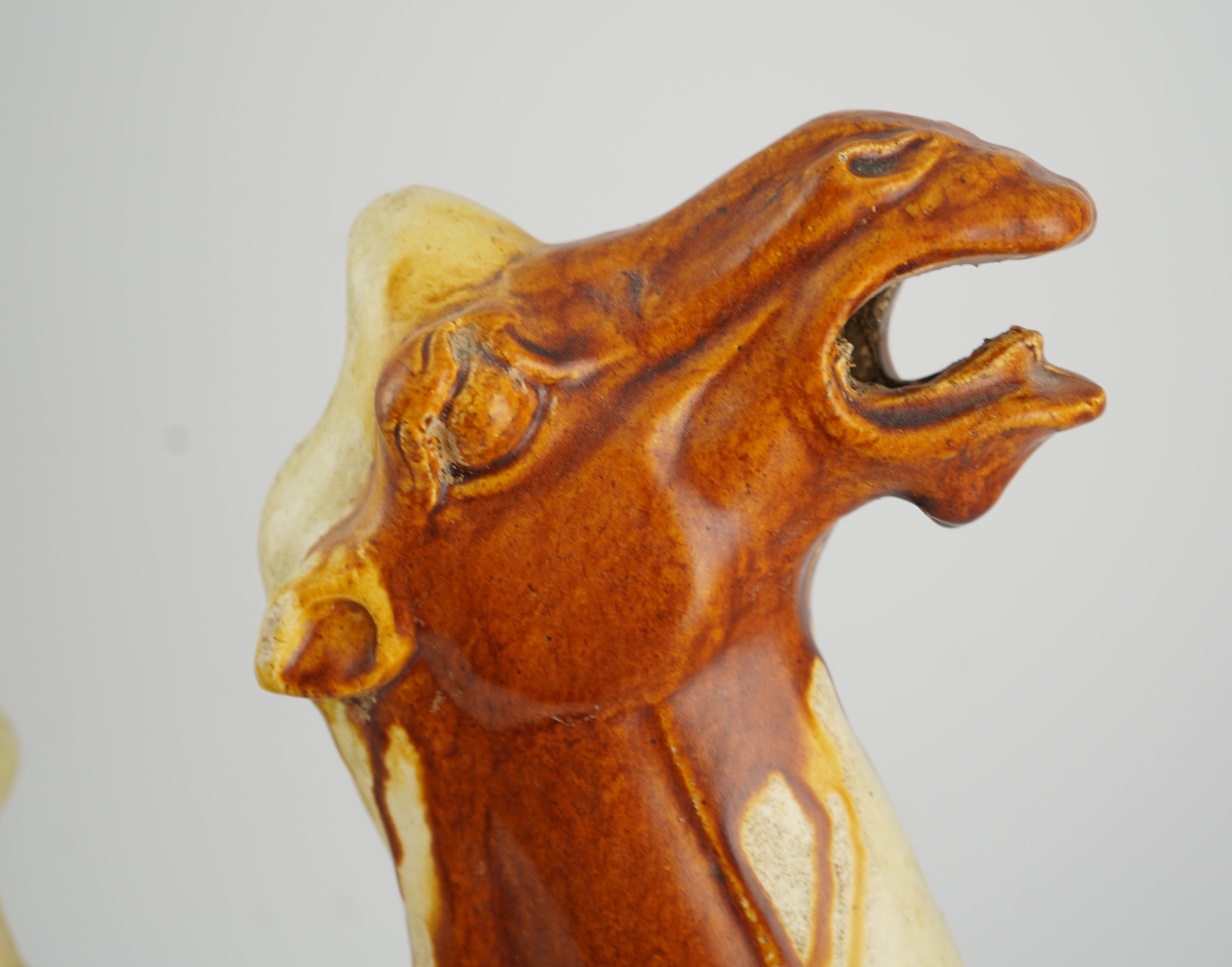 A large Chinese sancai pottery figure of a bactrian camel, Tang dynasty